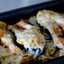 Форель под чесночным соусом, запеченная на картофельной "подушке