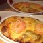 Креветки, запеченные с овощами под сырной корочкой