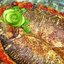 Запеченный карп на подушке из лука и моркови