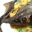 Осетр фаршированый овощами