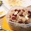 Каша из зерновых хлопьев с сушеной клюквой, изюмом и орехами
