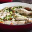 Окунь с луком-пореем, помидорами и грибами